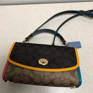 Coach Crossbody, multi color signature. This is a really nice crossbody bag.